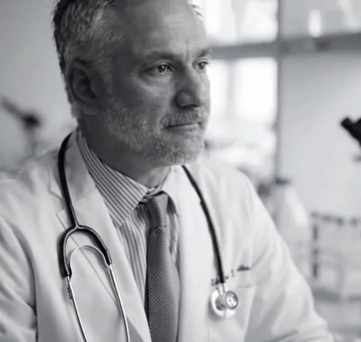 Physician reflecting in his practice