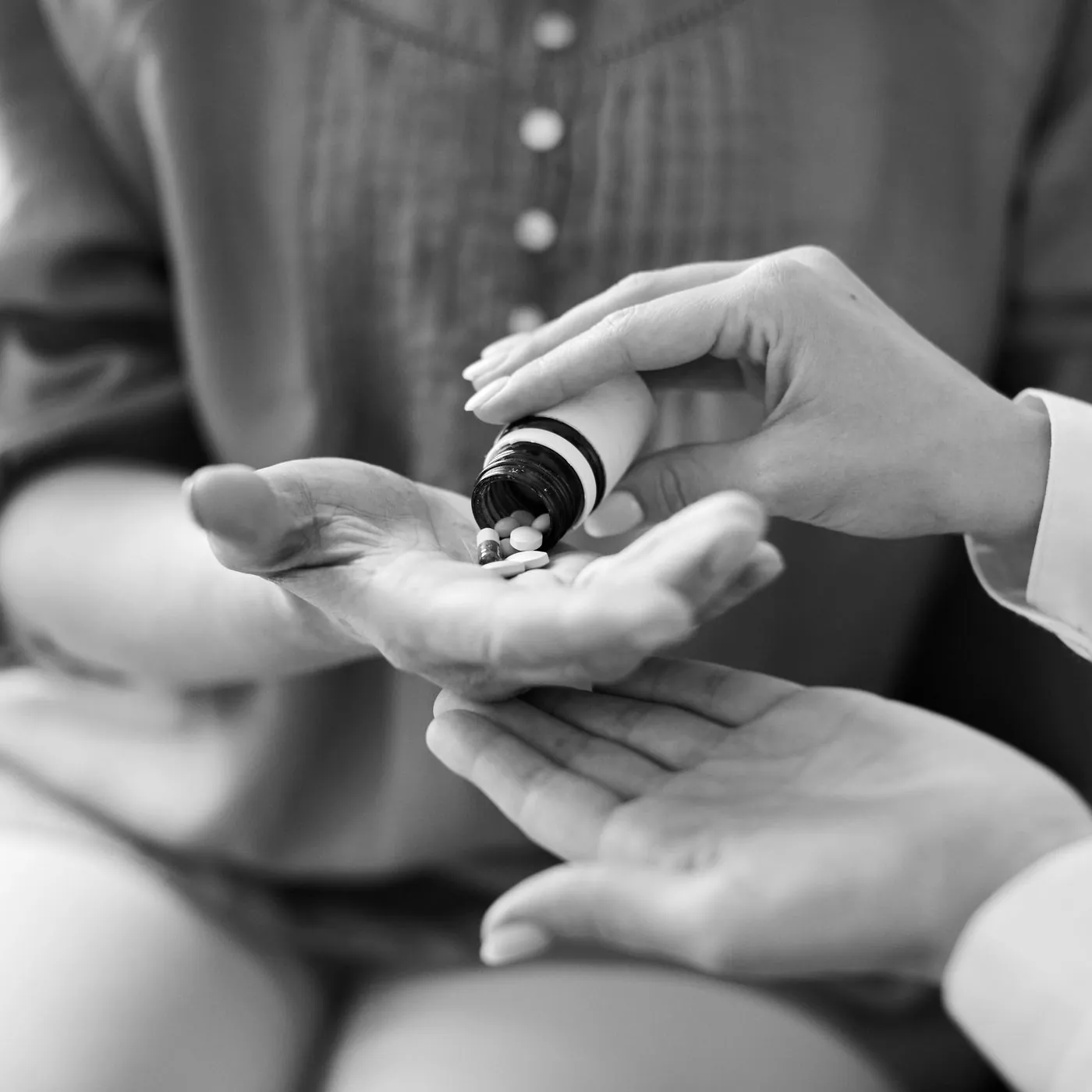 Physician handing a patient their medication